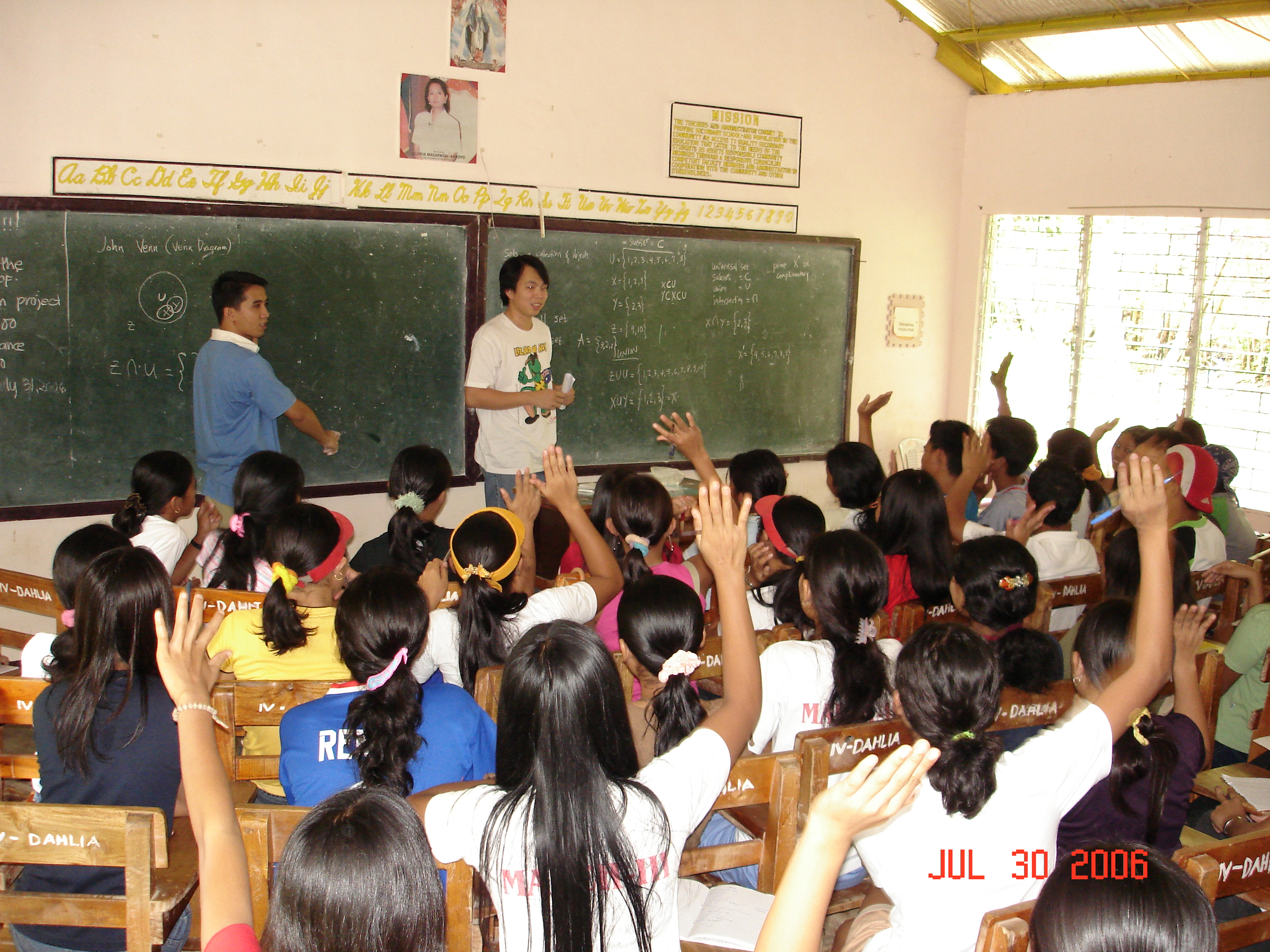 Emerson Go, Dara's better half, lends a hand to help students